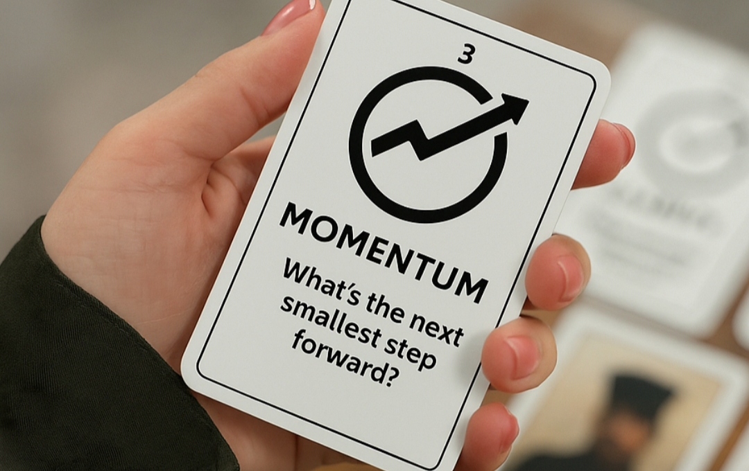 Hand holding a Momentum resilience card